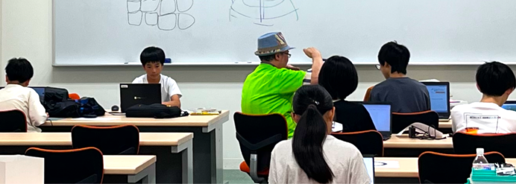 さとっちが生徒を指導している